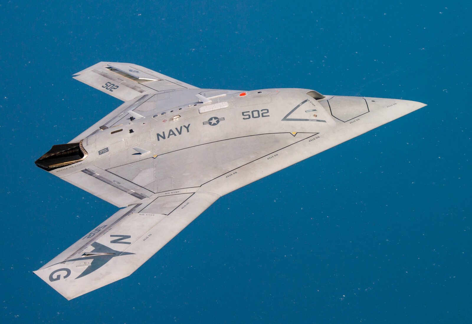 Fixed-wing UAV with a blended composite fuselage in flight